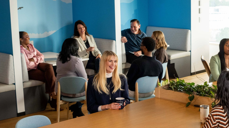 a group of people sitting around a table