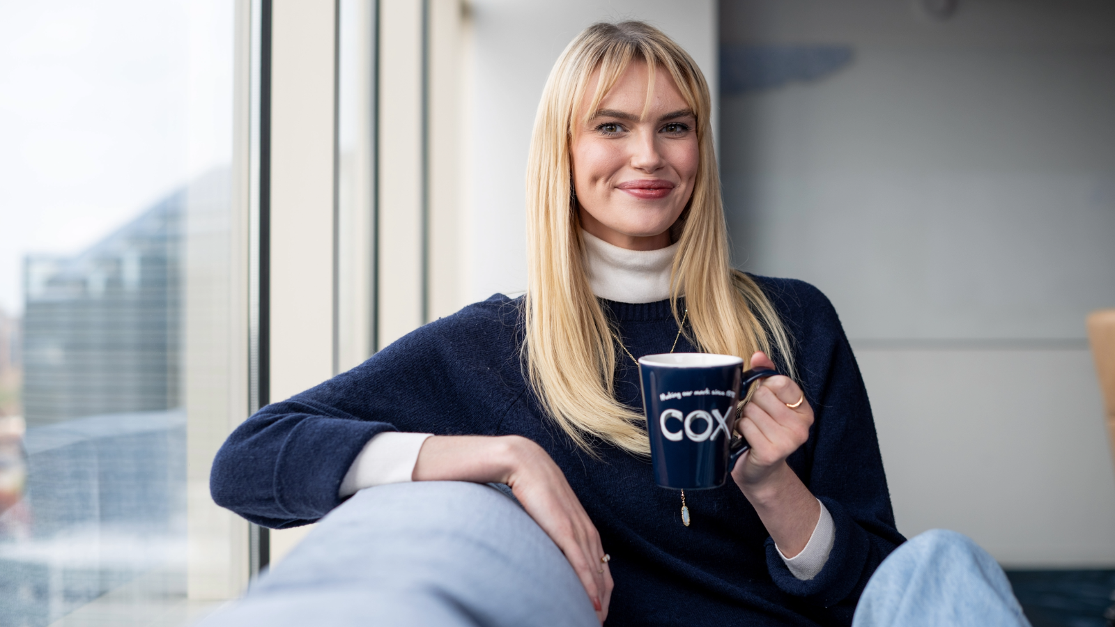 a person holding a cup