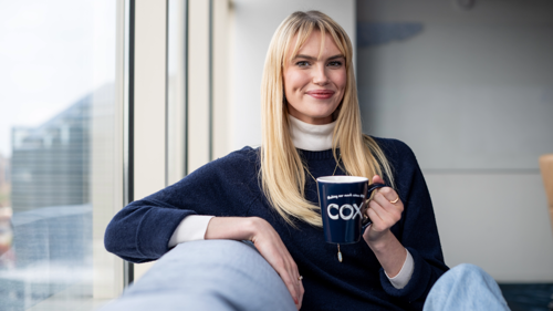 a person holding a cup
