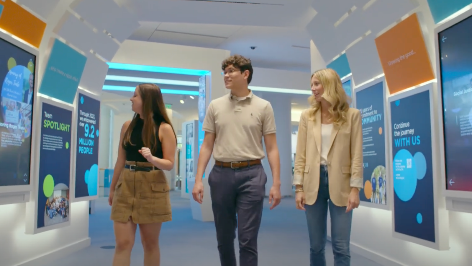 a group of people walking in a room