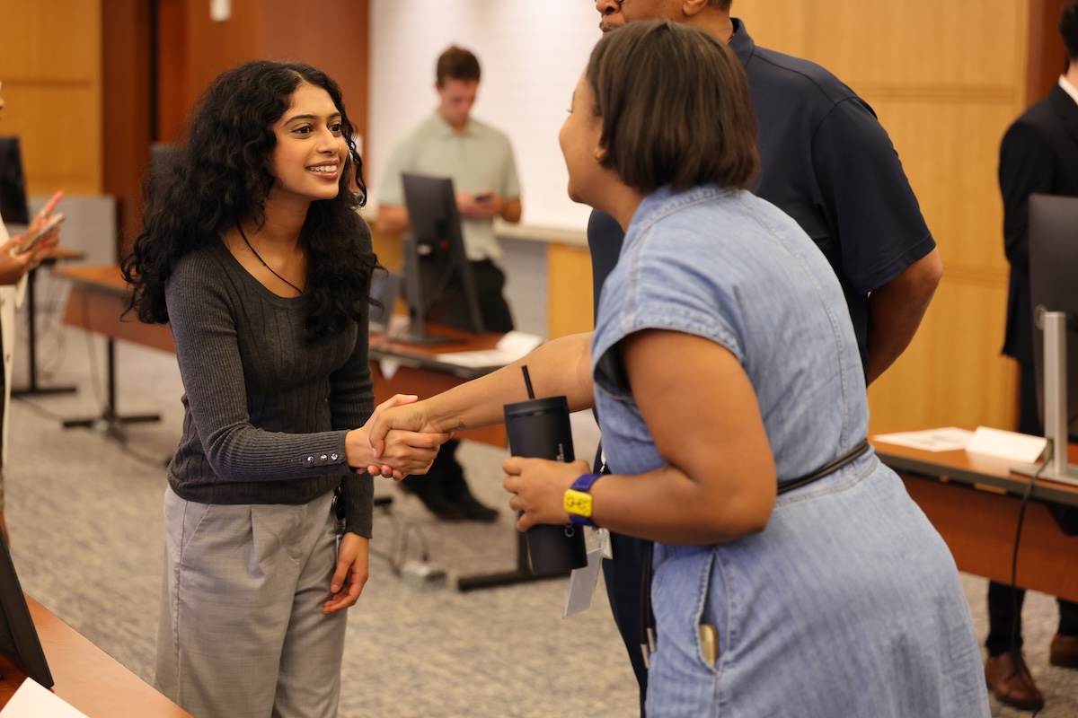 a person shaking hands with another person