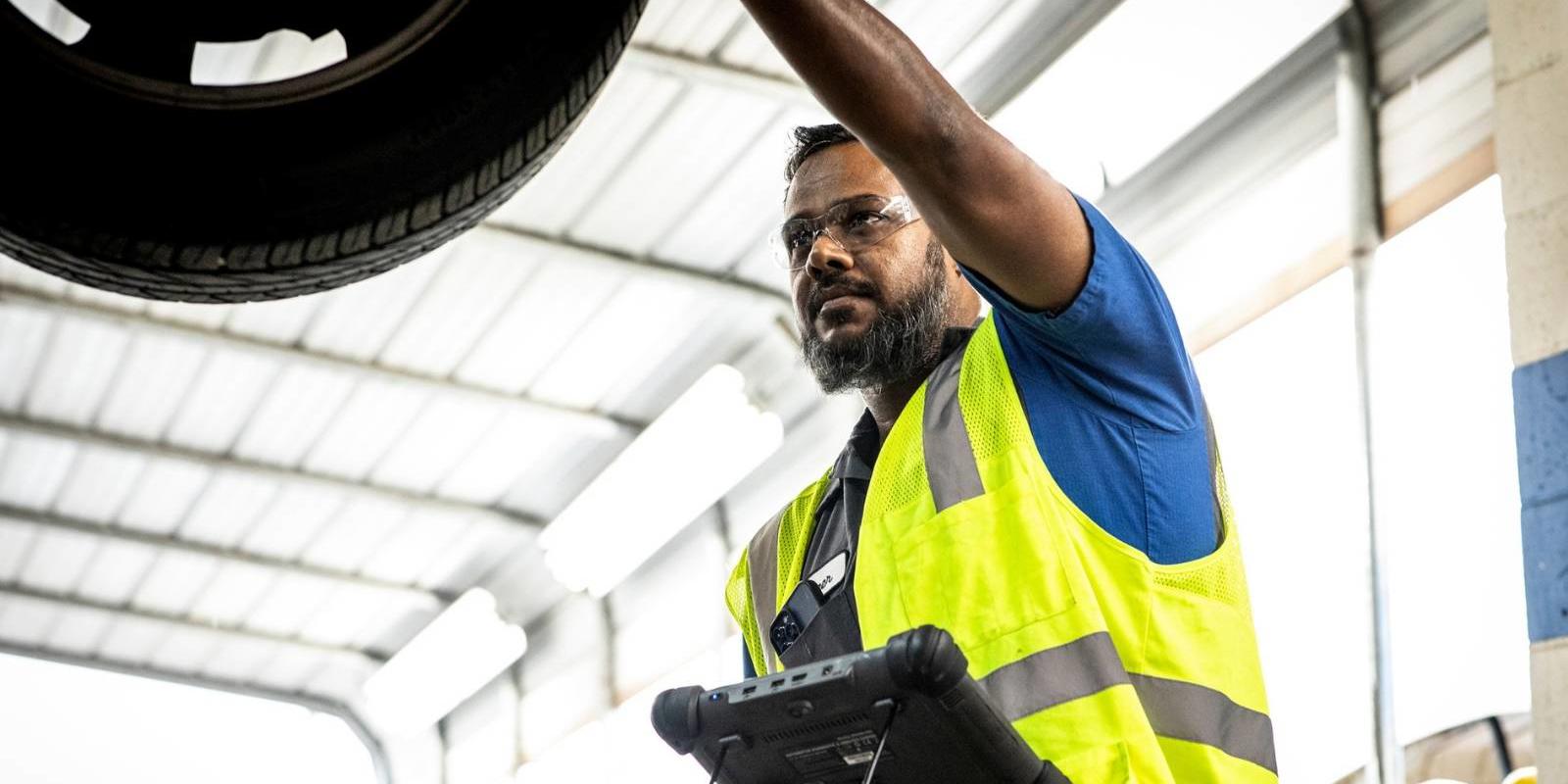 Cox auto technician fixing car