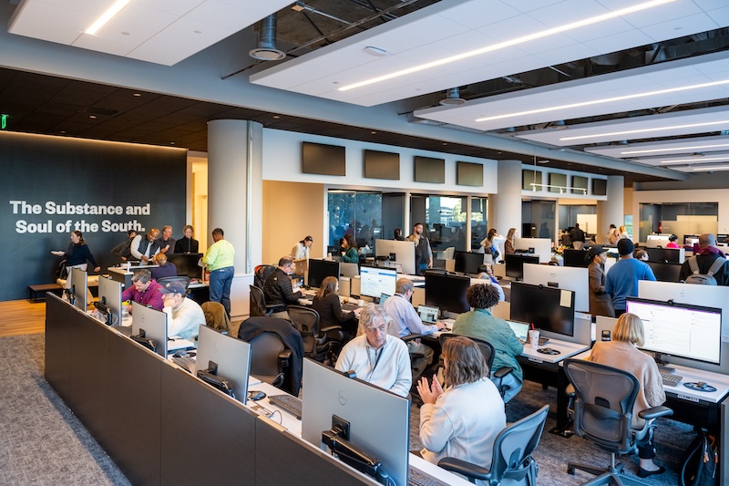 a group of people sitting at computers