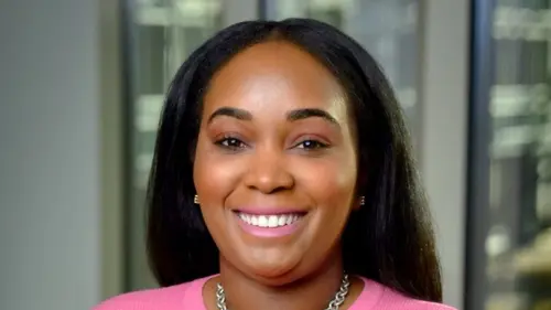 a person wearing a pink sweater
