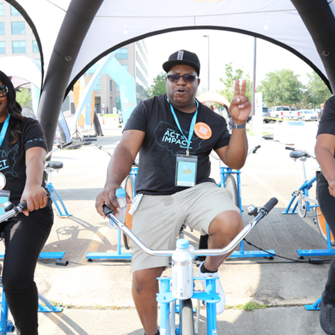 Cox employee riding bikes at 34x34 festival
