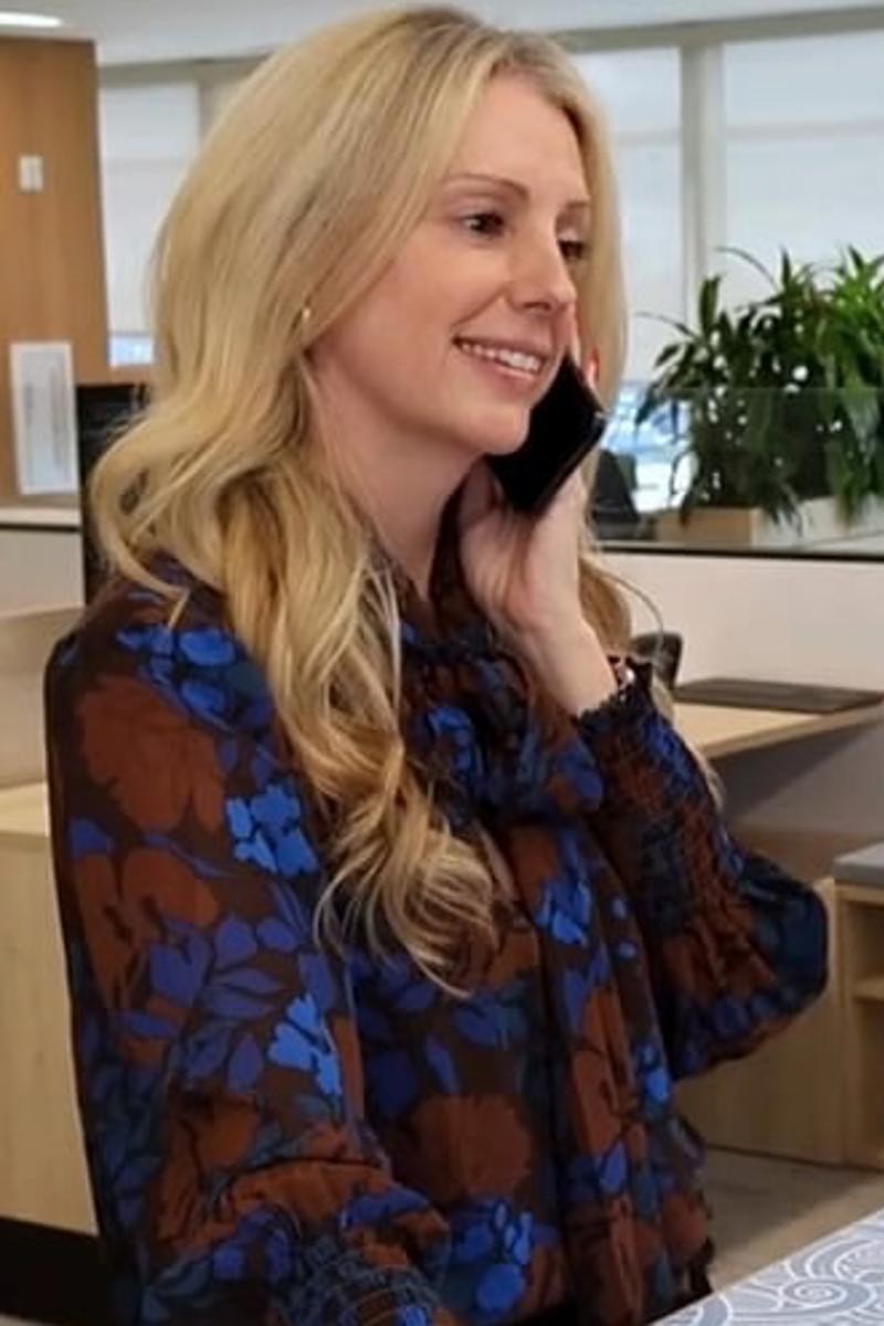 cox employee sitting at a desk talking on the phone