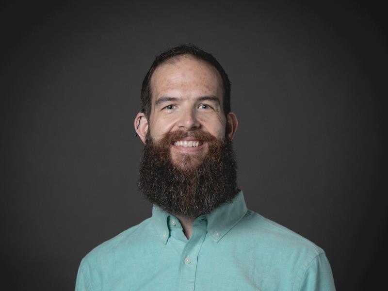 Cox employee smiling at camera