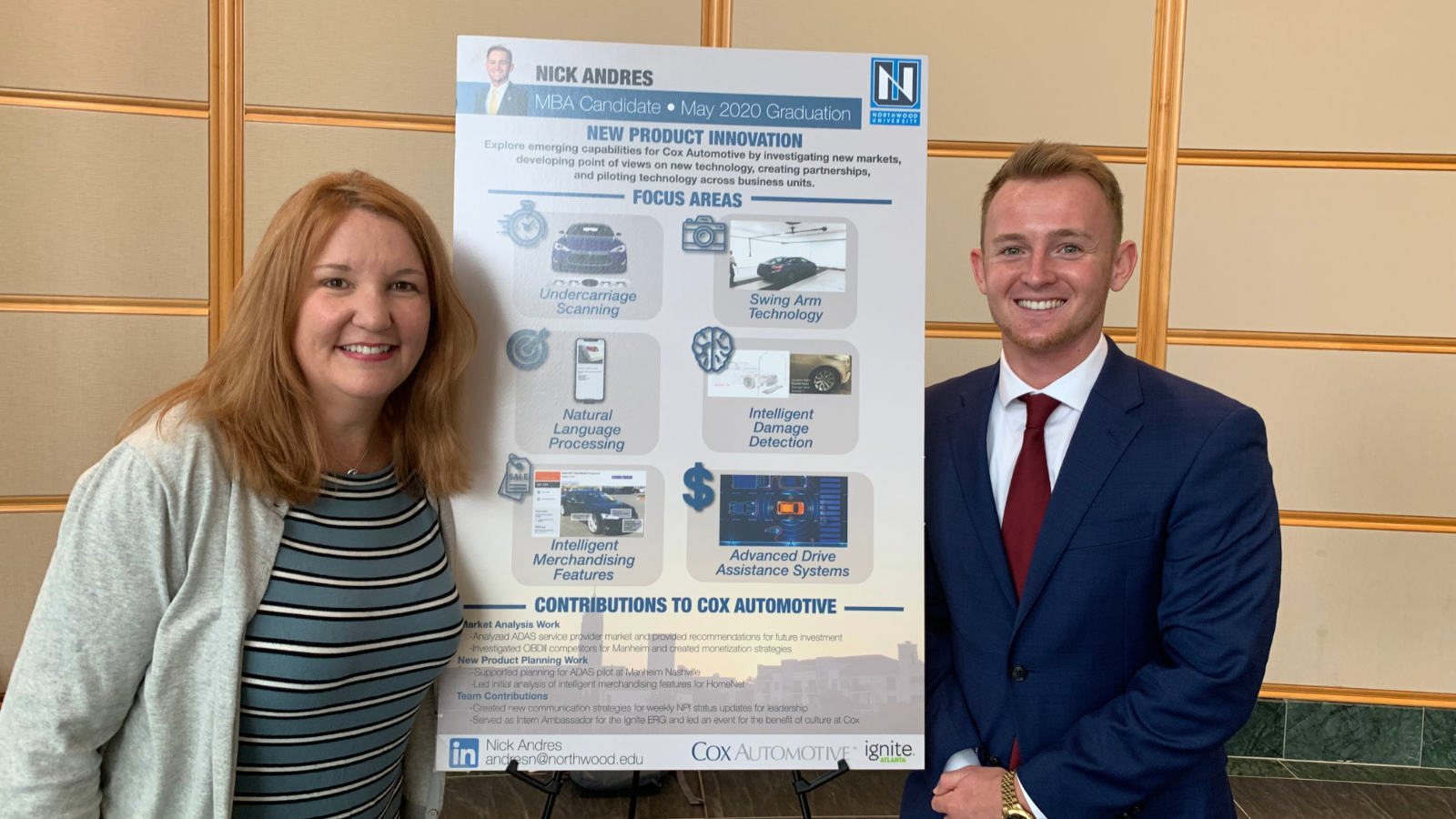 a person and person standing next to a poster
