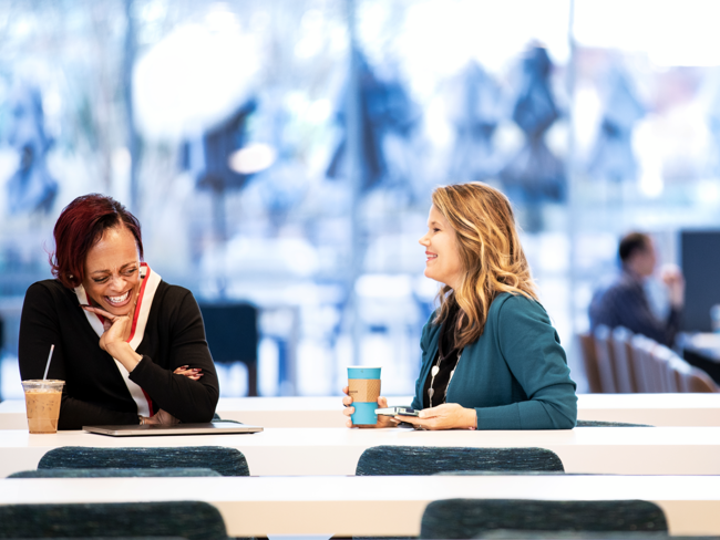 Cox employees collaborating in the work cafe