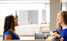 a couple of women looking at each other