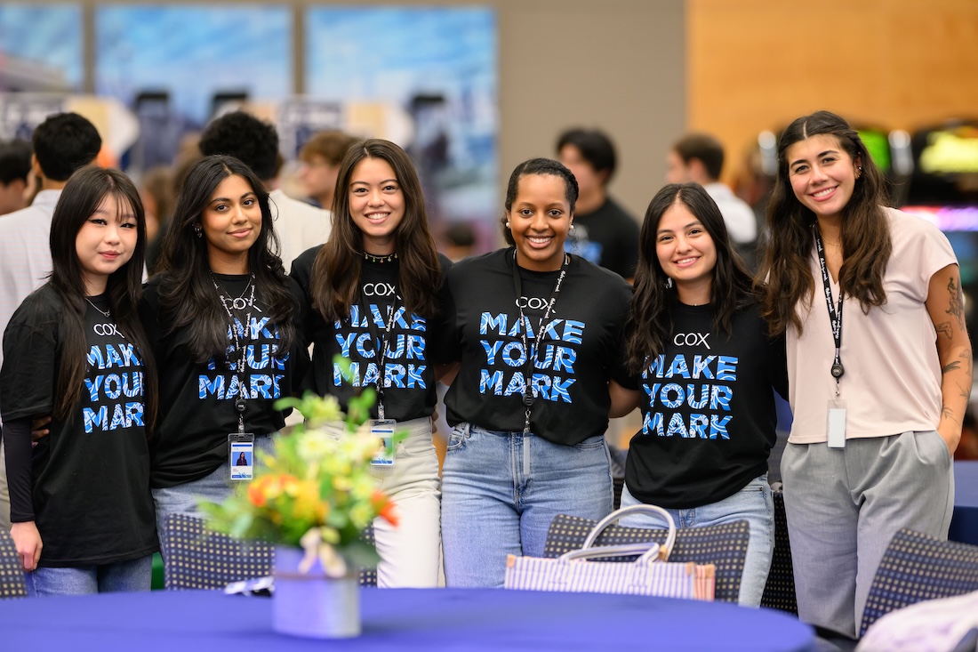 a group of women posing for a photo