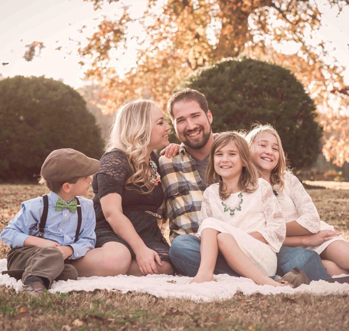 Glenn Starcher with his wife, Kristin, and their three children.
