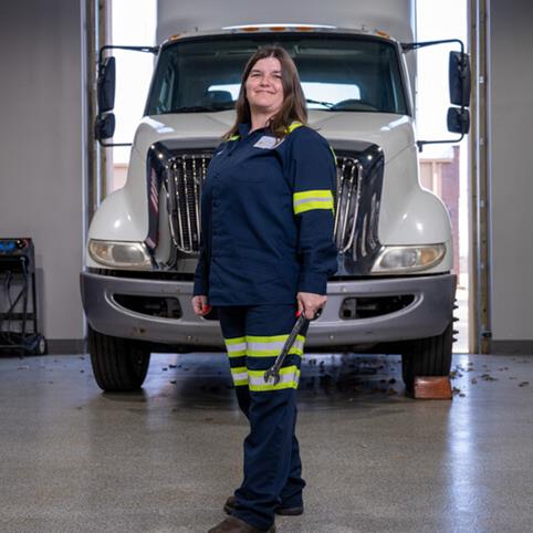 Cox automotive woman technician with a wrench