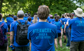 a group of people in blue shirts