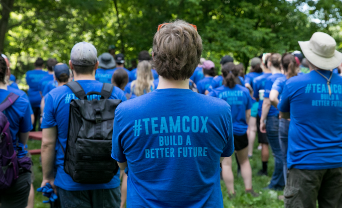 a group of people in blue shirts