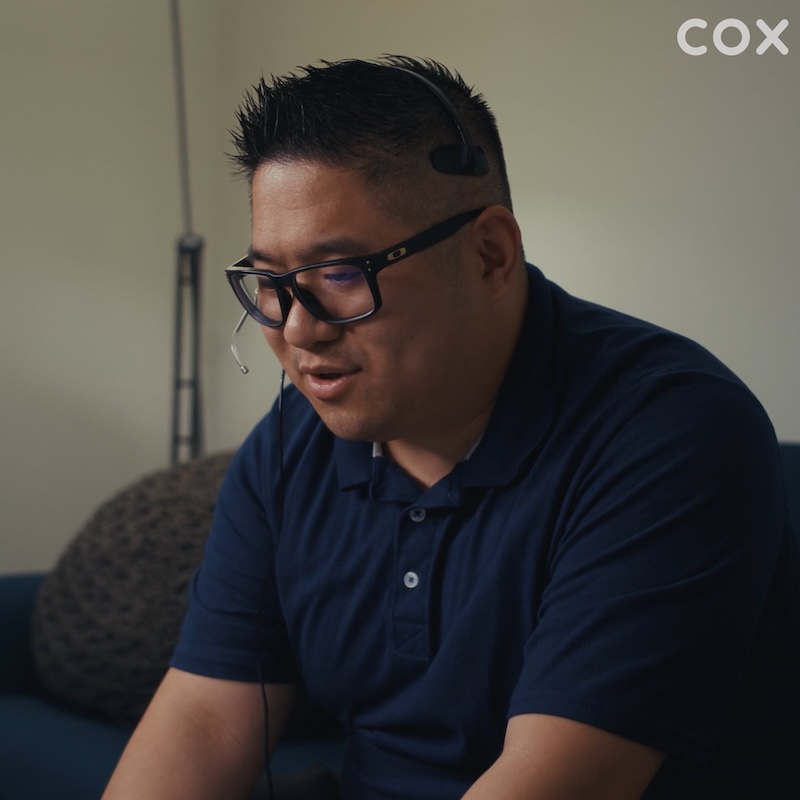 a person wearing glasses and a headset