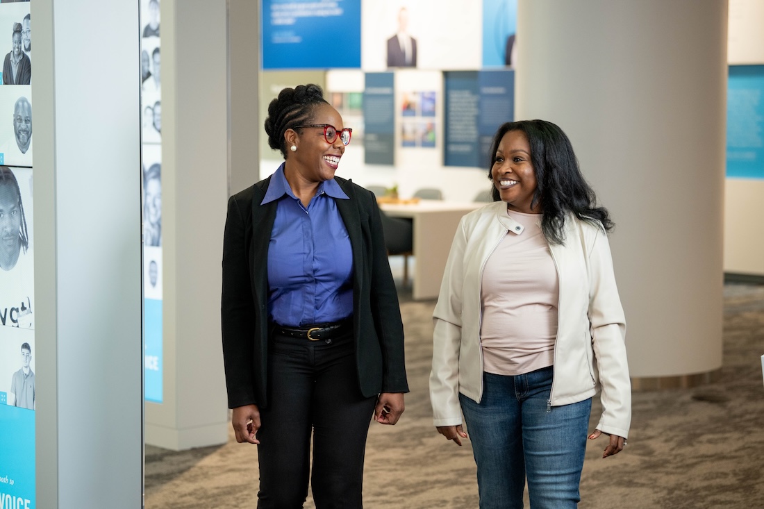 a group of women standing in a room