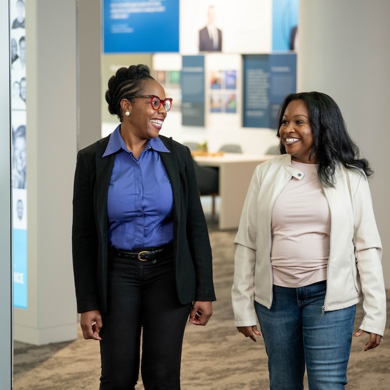 a group of women standing in a room