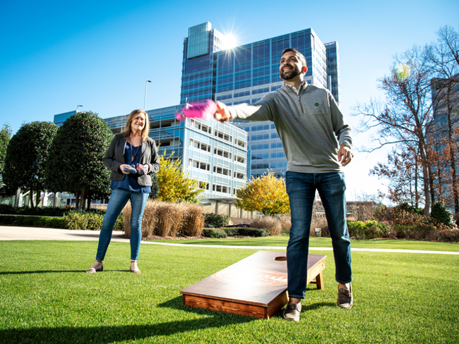 Cox employees playing corn hole