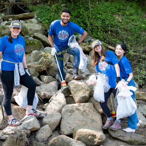 Cox employees cleaning up the river
