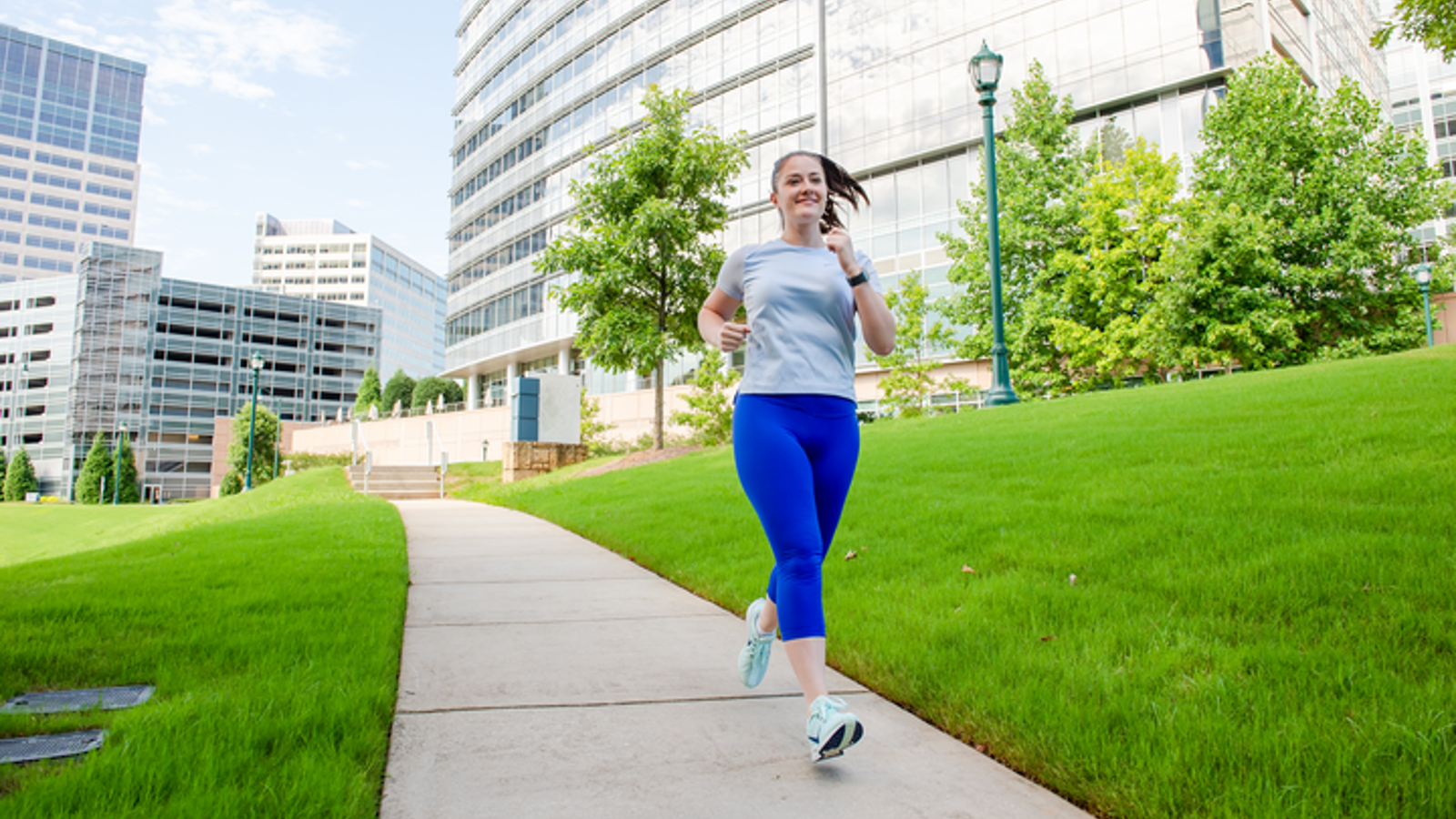 Cox employee running outdoors on campus