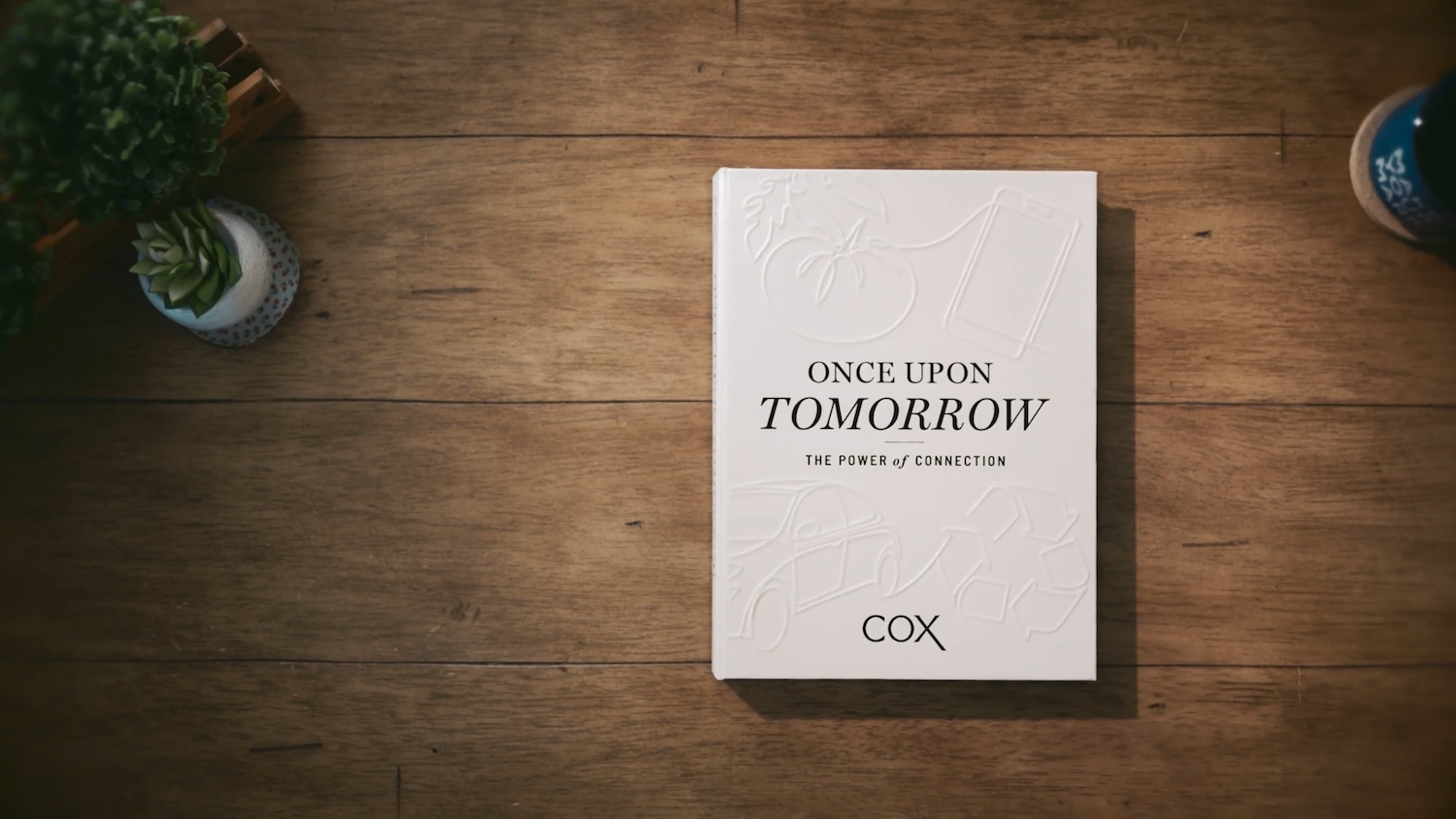 a white book on a wooden surface