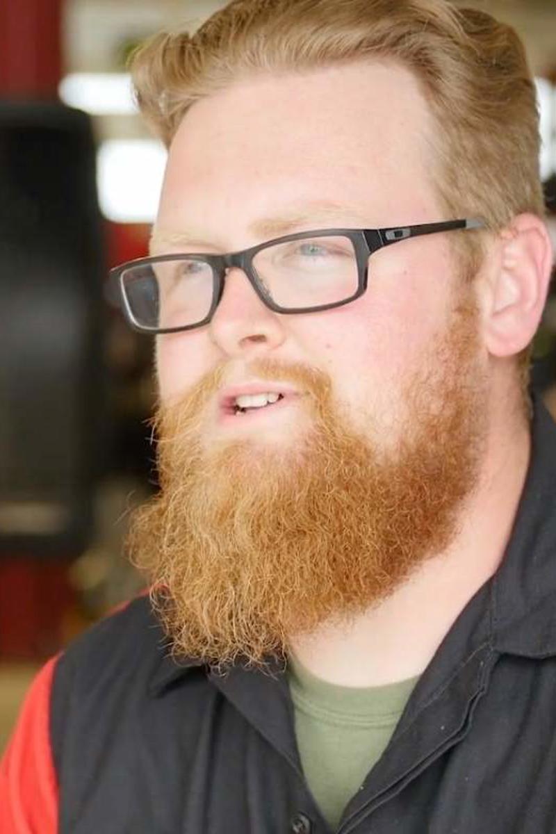 a person with a beard and glasses