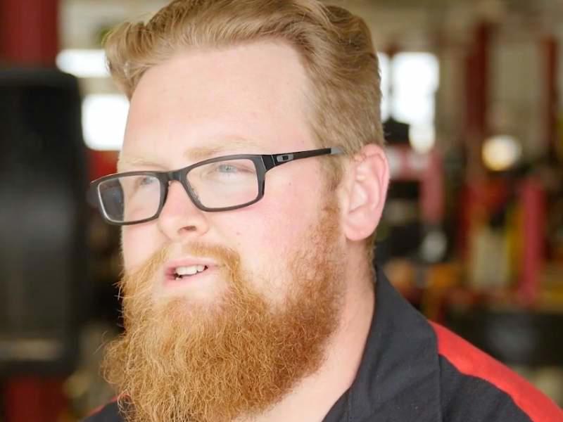 a person with a beard and glasses