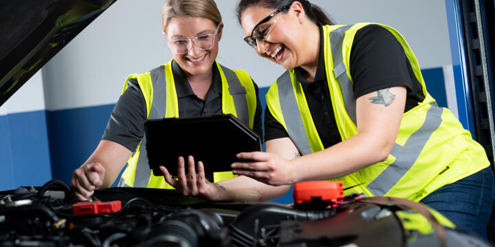 cox automotive women fixing car