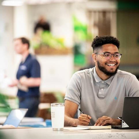 Cox employee working on computer (1)