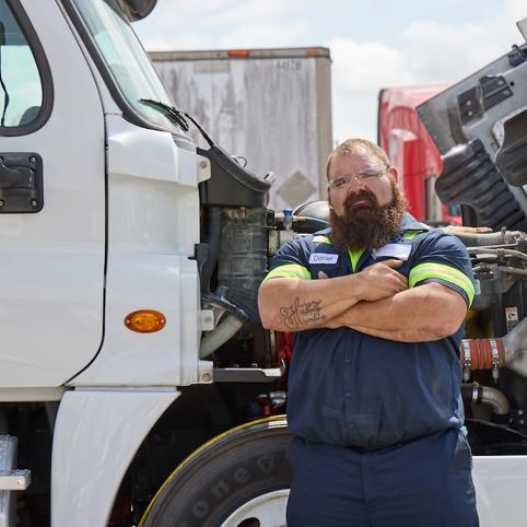 Cox Auto Employee Posing In Front Of Truck