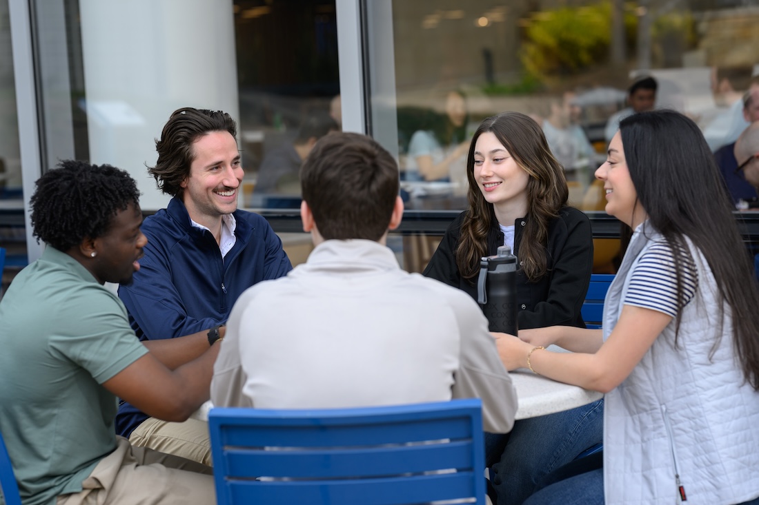 a group of people sitting at a table