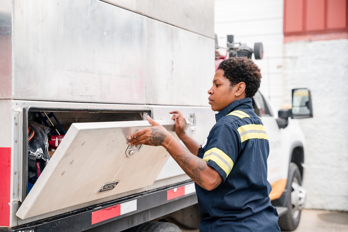 a person opening a tool box