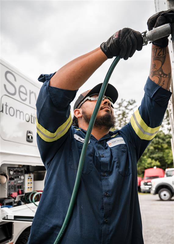 a person holding a hose
