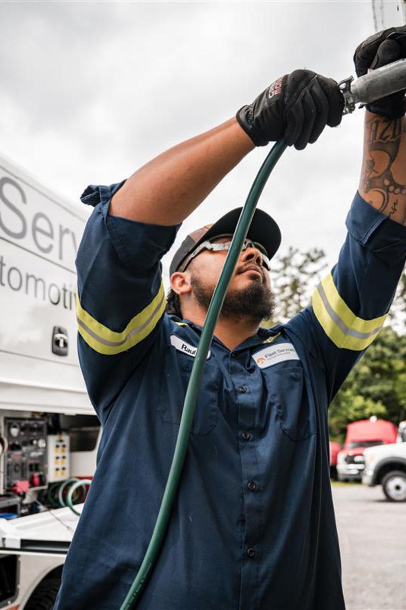 a person holding a hose