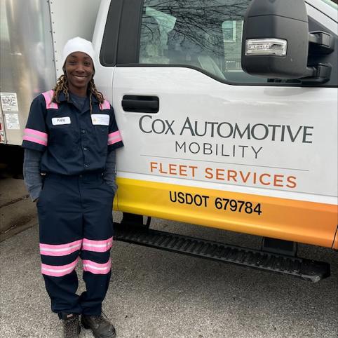 Cox Auto Employee Posing In Front Of Truck