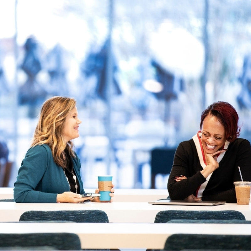 Cox Employees working in the office cafe