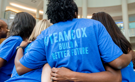 Cox employees in volunteer shirts