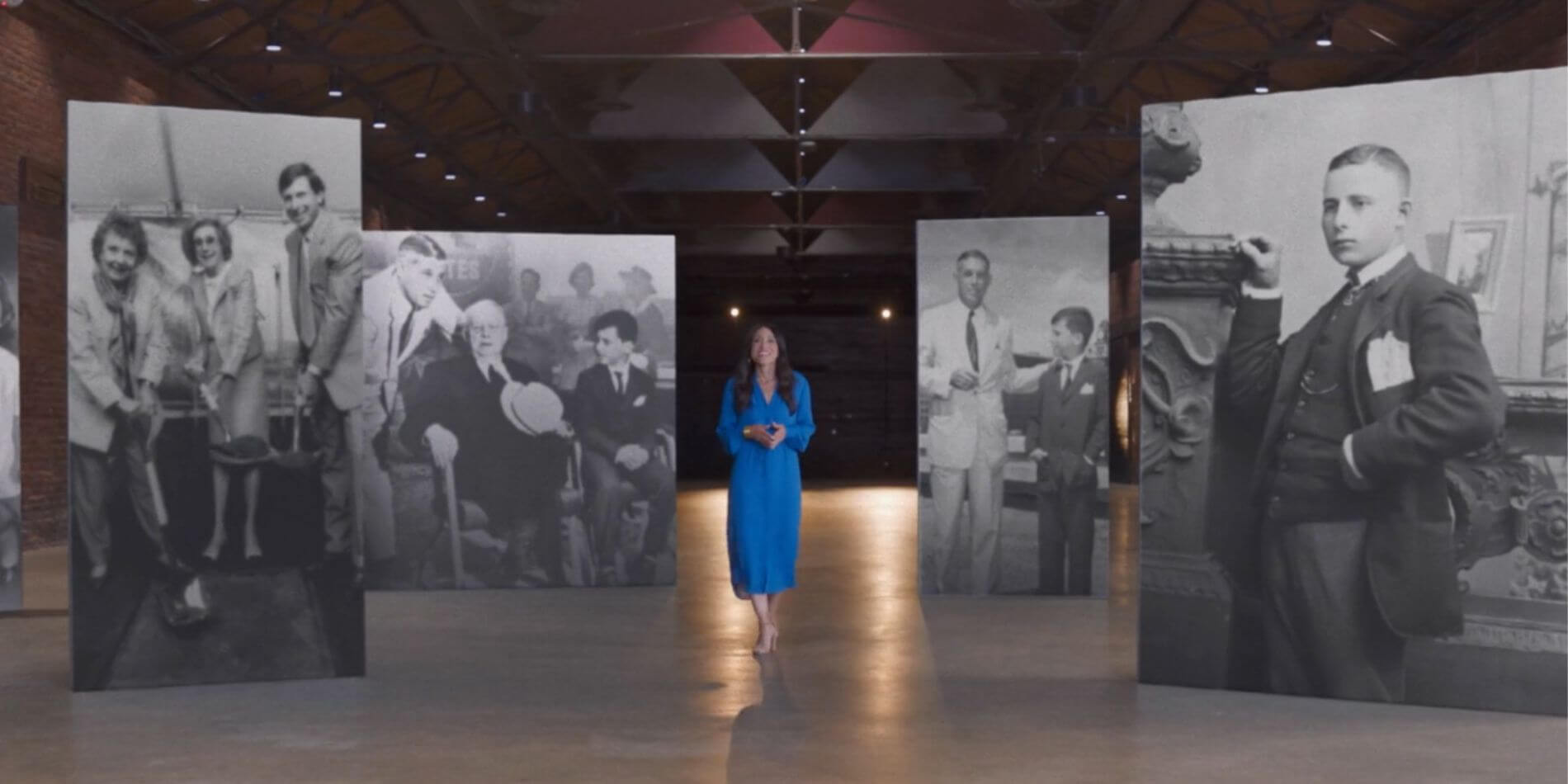 Cox employee with historical Cox images in the background