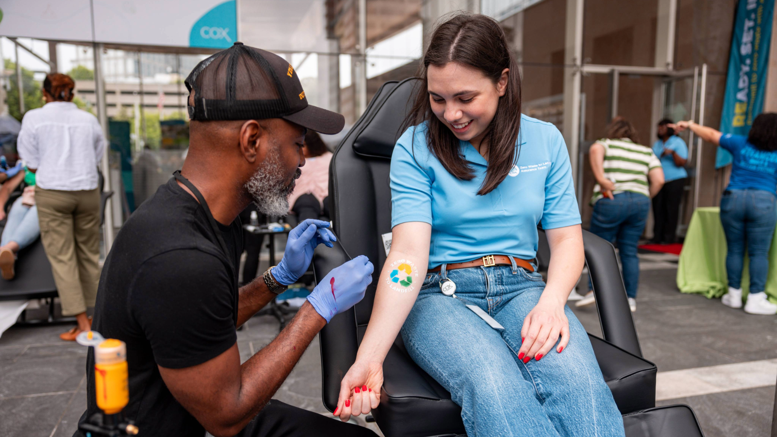 a person getting a tattoo on a person's arm