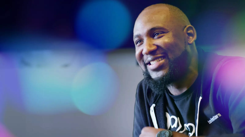 a person smiling with a beard