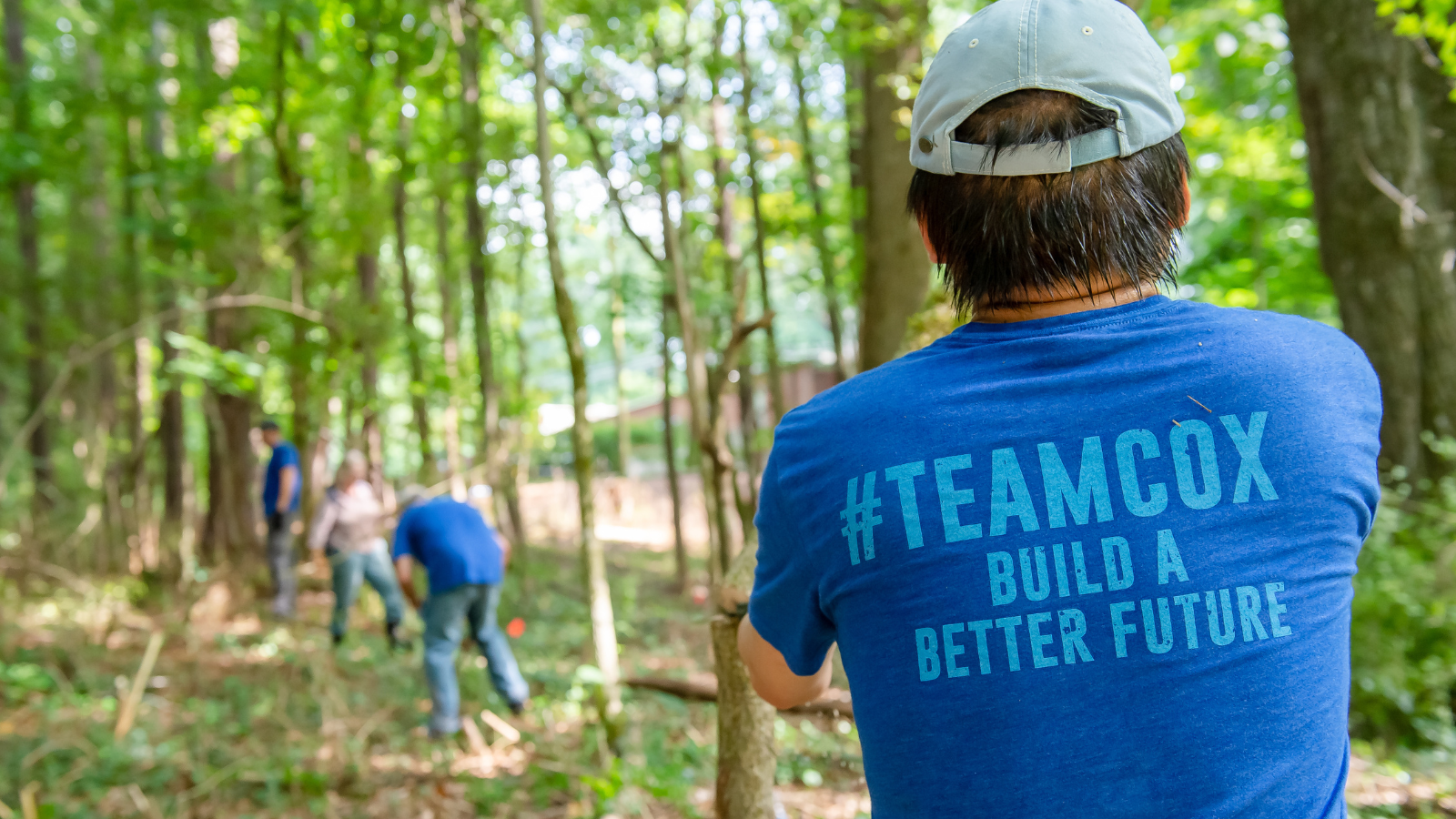 cox employee wearing a volunteer shirt