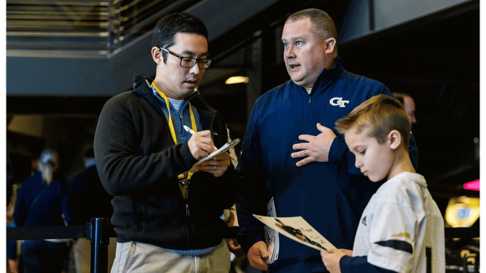 An AJC employee taking notes during an interview