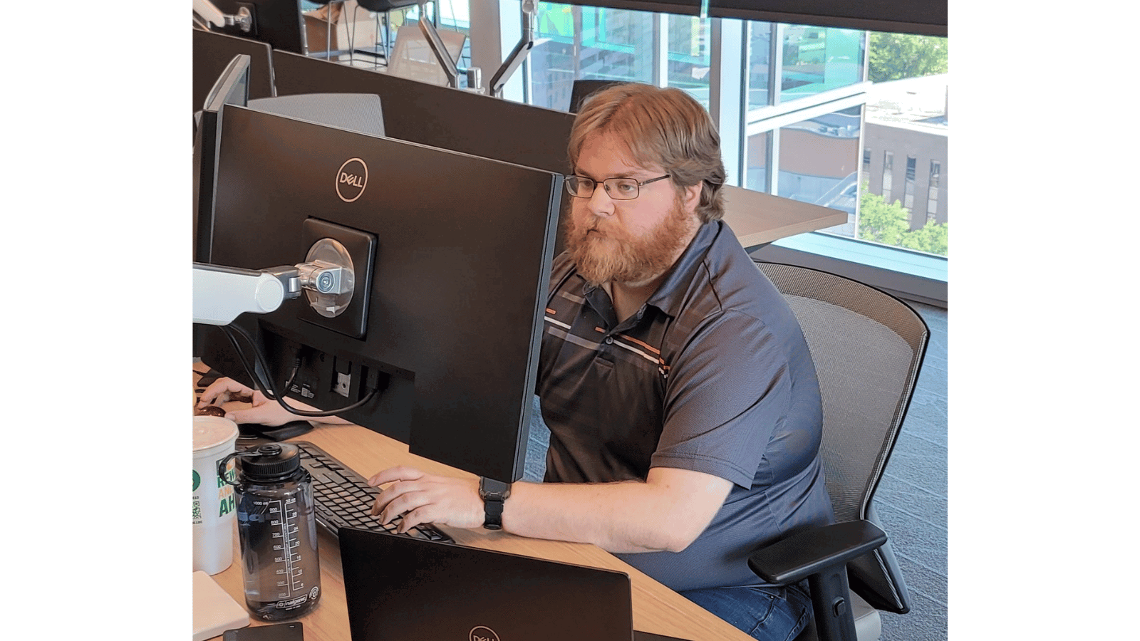 Chris Davis Cox employee on computer