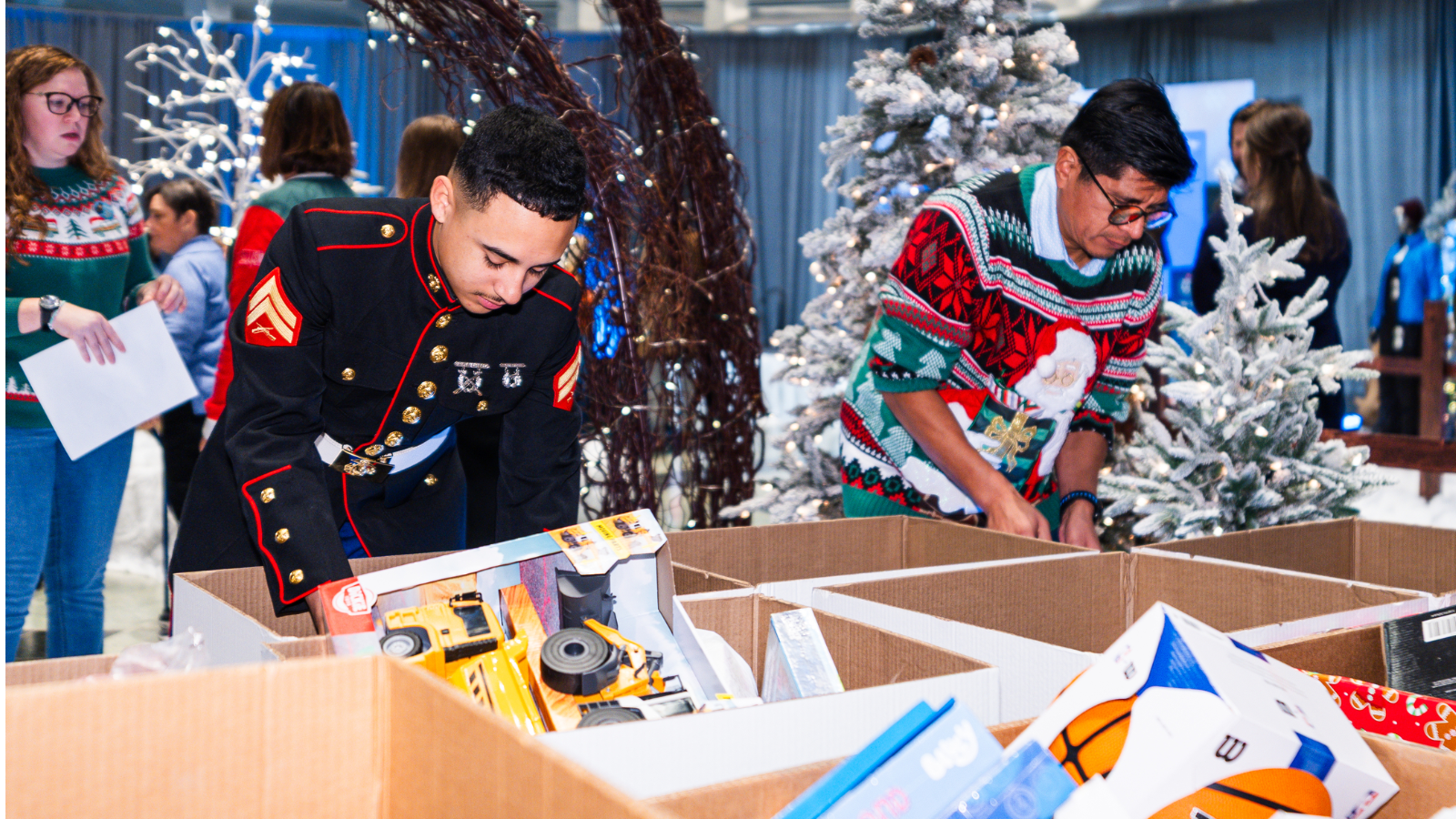 a person in uniform looking at a box of toys