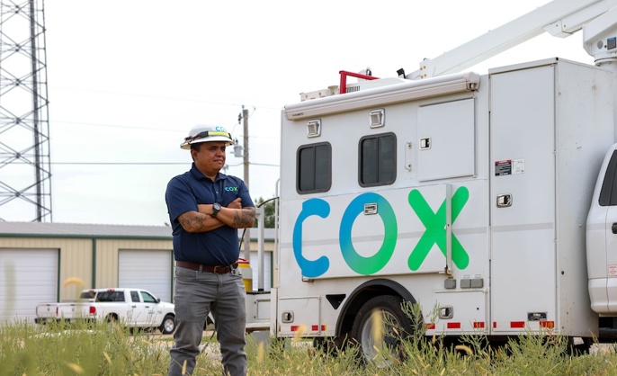 a person standing in front of a truck