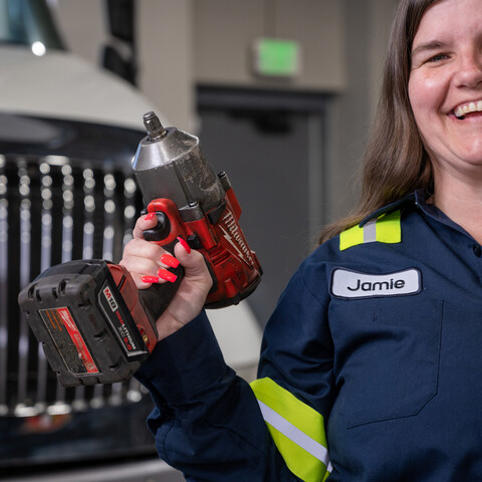 ox automotive employee with tools