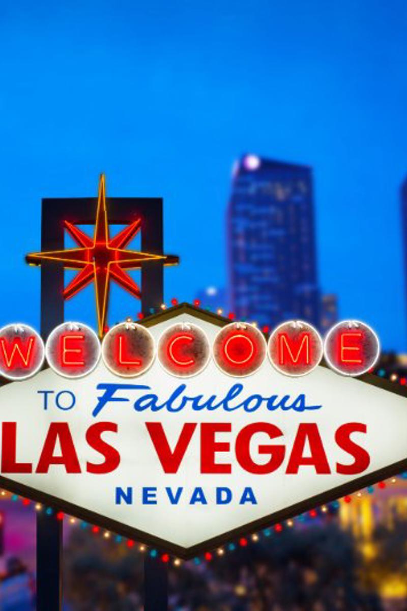 a sign with a city in the background