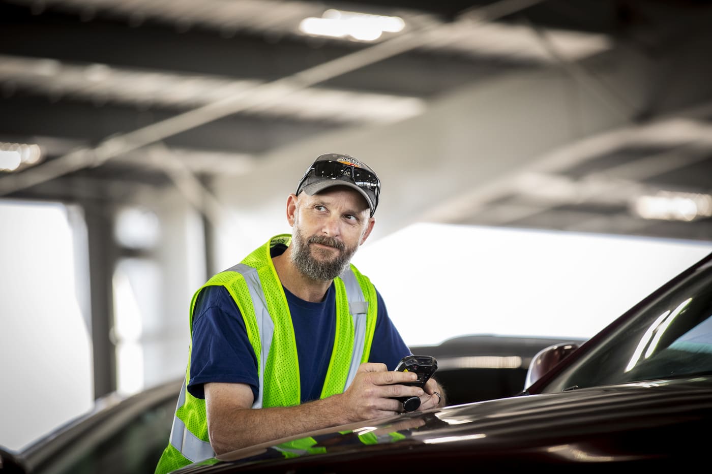 a person in a reflective vest holding a phone