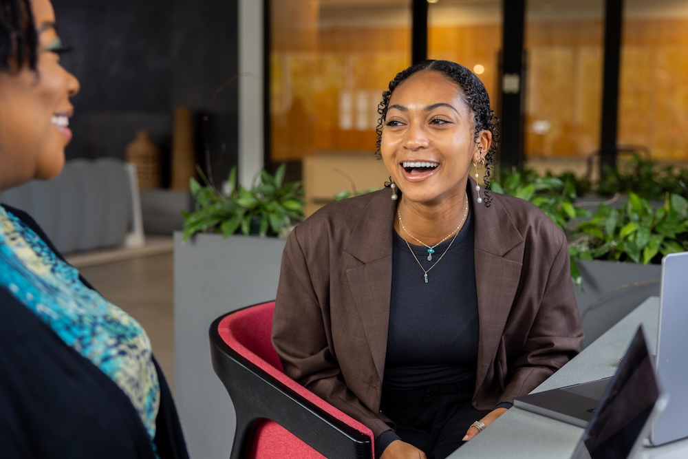 a person sitting in a chair laughing